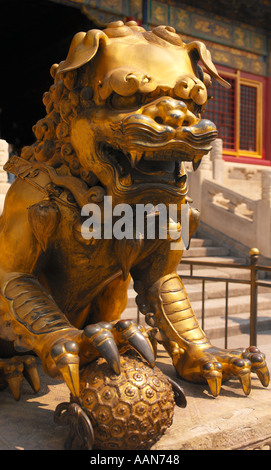 Statue of a lion guarding an gateway to the Forbidden City in Beijing in China Stock Photo