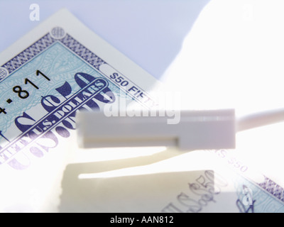 MODEM PHONE CABLE AND FIFTY DOLLAR TRAVELLERS Stock Photo