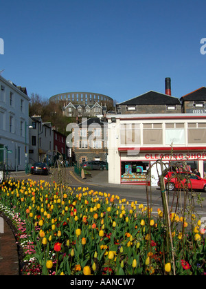 Oban town centre with The Oban Distillery in the centre and McCaig's Folly behind on the hill. Stock Photo