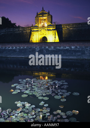 Phillipines Manila Santiago fort at dusk across lilies in moat Stock Photo
