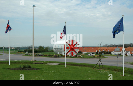 Channel Tunnel boring machine used as memorial to workforce who built rail link Coquelles France with flags of UK France and EU Stock Photo