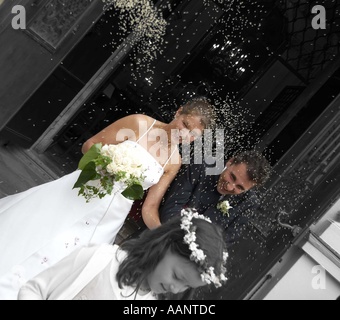 bridal couple / rice casting Stock Photo