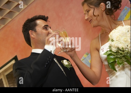 bridal couple clinking glasses with champagne Stock Photo