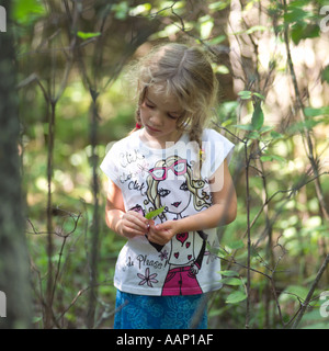 Blonde girl in forest Lake of the Woods Canada Stock Photo