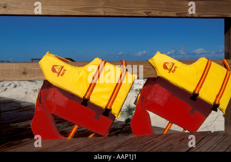 Beach Colorful red yellow life jackets Stock Photo