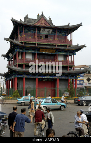 City traffic passes by in front of a pagoda in Datong, Shanxi, China. Stock Photo