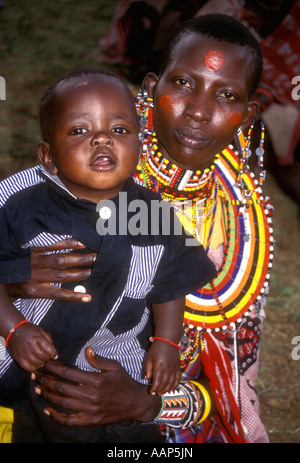 Portrait of a Maasai woman with her young son Masai Mara National Reserve Kenya East Africa Stock Photo