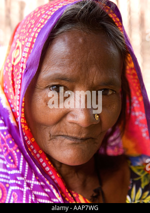 Portrait Of An Old Lady With A Pierced Nose In The Hood Near Pokhara 