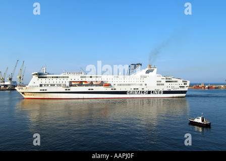 Palermo Sicily port facilities with ferry slowly approaching birth with Pilots launch standing by