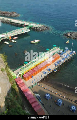 Sorrento coastal resort looking down on prepared waterside sunbathing equipment viewed before the daily influx of sunseekers arrives at Bay of Naples Stock Photo