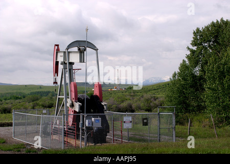 OIL INDUSTRY near the Canadian Rocky Mountains in Alberta Canada Stock Photo