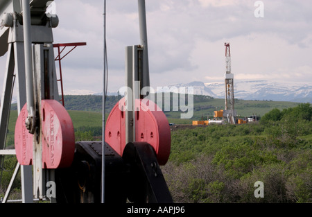 OIL INDUSTRY near the Canadian Rocky Mountains in Alberta Canada Stock Photo