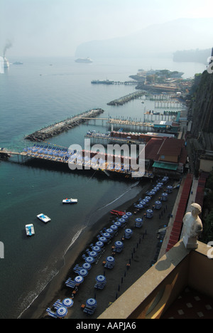 Sorrento resort view along sunbathing facilities seen before the daily influx of sun worshipers arrive from nearby hotels with cruise ships at anchor Stock Photo
