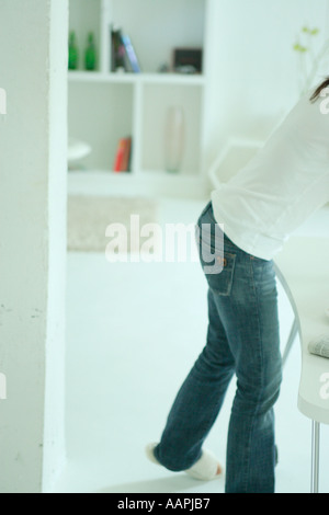 Unrecognizable woman in living room Stock Photo