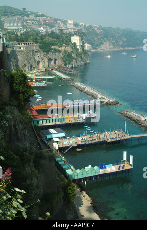 Sorrento resort a view looking down on sunbathing facilities before the daily influx of sun worshipers arrive with this view of Bay of Naples in Italy Stock Photo