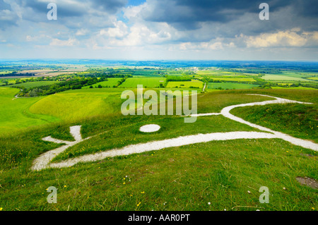 View over the Vale of White Horse, the Uffington White Horse and Dragon Hill from Whitehorse Hill in Oxfordshire, England. Stock Photo