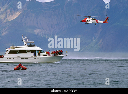 RESCUED PASSENGERS from the YORKTOWN CLIPPER with COAST GAURD HELICOPTER assist GLACIER BAY ALASKA Stock Photo