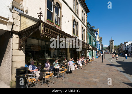 Cafe in the town centre with Moot Hall in the background, Keswick, Lake District, Cumbria, England, UK Stock Photo