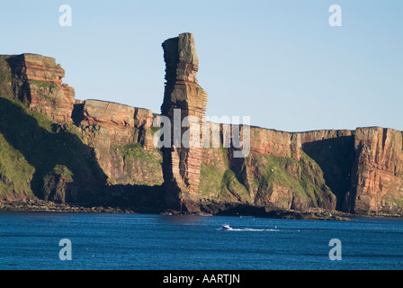 dh Old Man of Hoy HOY ORKNEY Scotland Small boat below Sea stack and seacliffs blue sea cliff rugged landmark boats