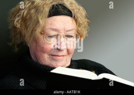 Senior woman reading Bible Stock Photo