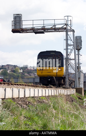 Local commuter train passing through Horbury Bridge Northern Class 142 in First North Western livery Stock Photo