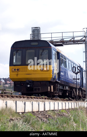 Local commuter train passing through Horbury Bridge Northern Class 142 in First North Western livery Stock Photo