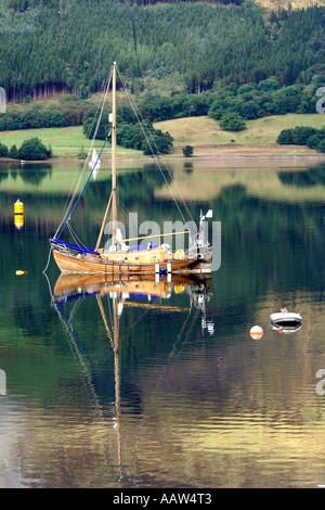 Lovely traditionally built wooden sailing boat moored on Loch Leven near Ballachulish Glencoe Stock Photo