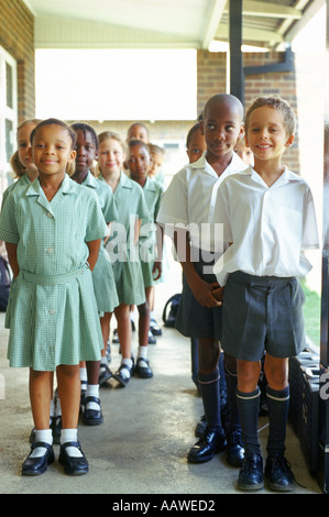 School children lining up outside classroom Johannesburg Gauteng South Africa  Stock Photo