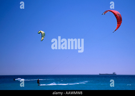 Kite surfers off Blouberg in Table Bay South Africa with an oil tanker in the background. Stock Photo