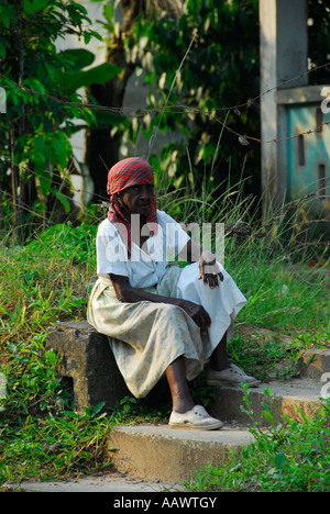 Black Garifuna woman sitting in Livingstone, Guatemala, Central America Stock Photo