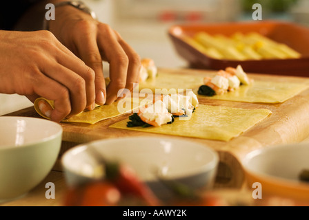 Cannelloni Filled with Shrimps and Spinach Baked with Putanesca step by step  Stock Photo