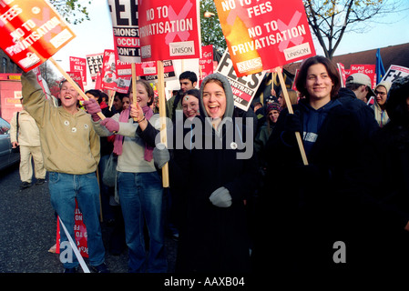 Student protest march through London demonstrating against government policy of privatization and student fees Stock Photo