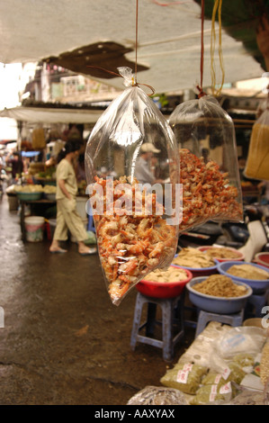 Dried prawns hanging in plastics bags in a Vietnamese market Stock Photo