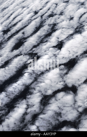 Mid level white clouds Altocumulus undulatus abstract background Stock Photo