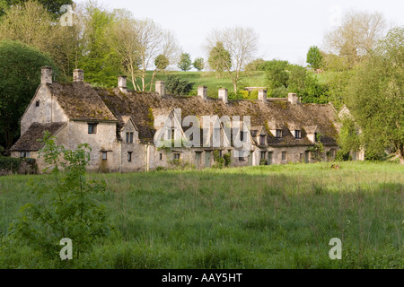 Early morning light falling on Arlington Row in the Cotswold village of Bibury, Gloucestershire Stock Photo