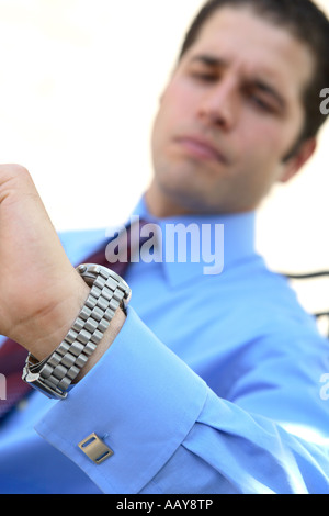 Businessman checking his watch Stock Photo