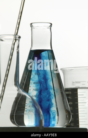 Chemical beakers flasks and other glassware still life on a white background Stock Photo