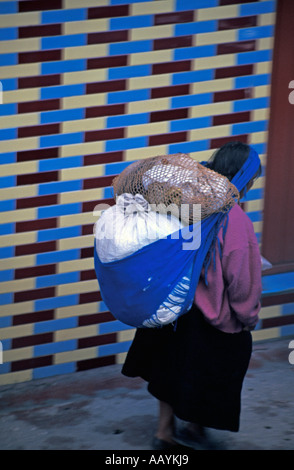 Moman overloaded with bags in San Cristóbal de las Casas, Mexico. Stock Photo