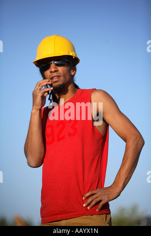 Construction worker talking on cell phone Stock Photo