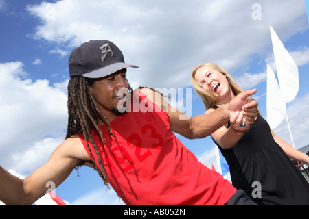 Young people having fun holding hands Stock Photo