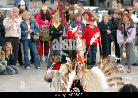 Indian show dancing and singing on the street in Warsaw playing for money Stock Photo