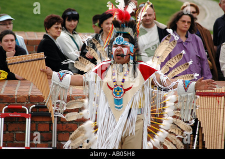 Indian show dancing and singing on the street in Warsaw playing for money Stock Photo