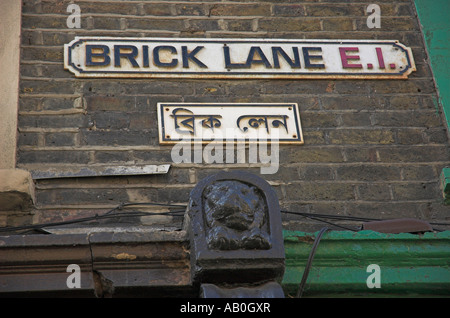 Brick Lane London street signs in both English and Arabic. London UK Stock Photo