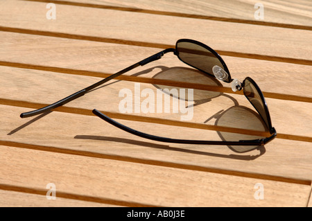 Sunglasses on a wooden table Stock Photo