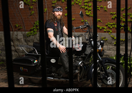 Bandana Motorcyclist, black leather jacket and tattoos Stock Photo