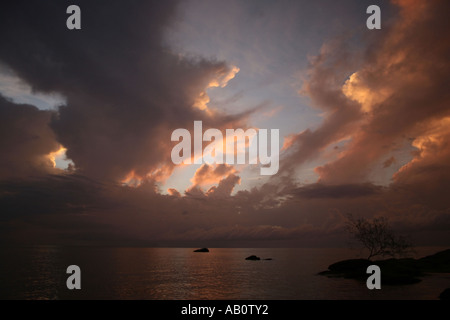 Heavy clouds rising in late afternoon sunlight over Lake Malawi Stock Photo
