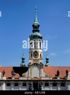 Picturesque clock tower, with onion shaped spire, of the Baroque Sanctuary of Our Lady of Loreto, Prague, Czech Republic. Stock Photo