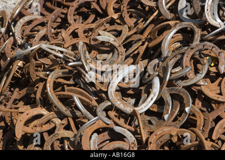 Heap of rusty horseshoes outside blacksmiths shop or Smithy, Scotland UK Stock Photo