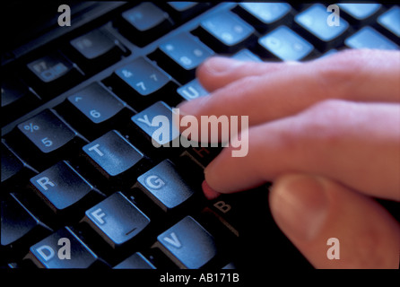 IBM laptop keyboard with hand Stock Photo