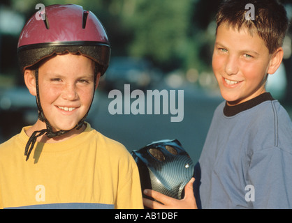 Portrait of boys with bike helmets Stock Photo
